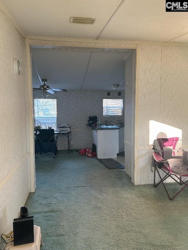 hall with visible vents and a sink