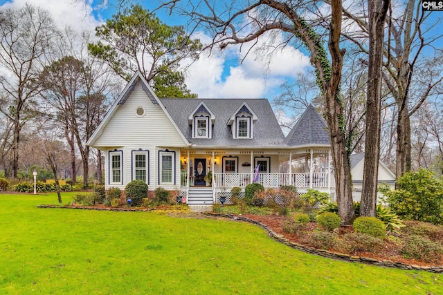 view of front of home with a porch, a front yard, and roof with shingles