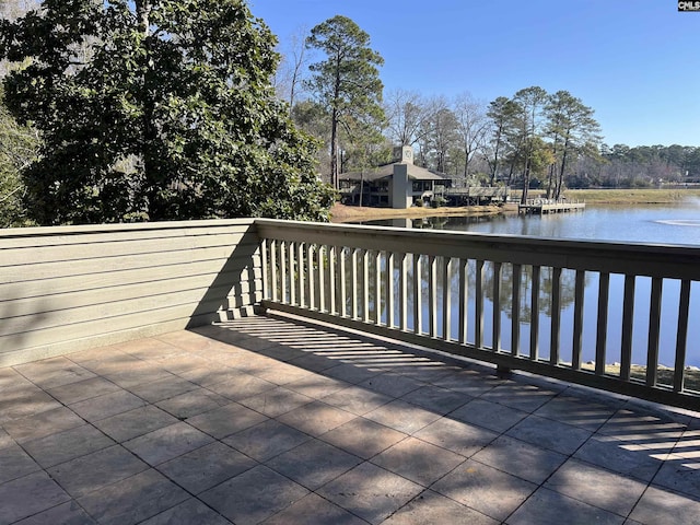 wooden deck featuring a water view