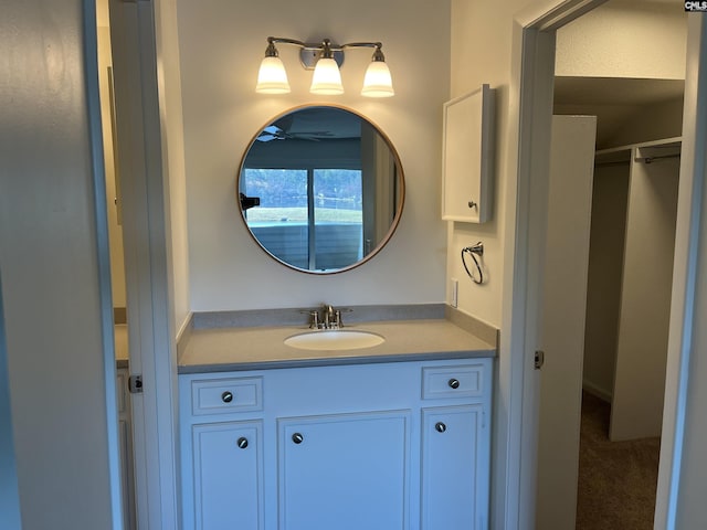 bathroom with vanity and a ceiling fan