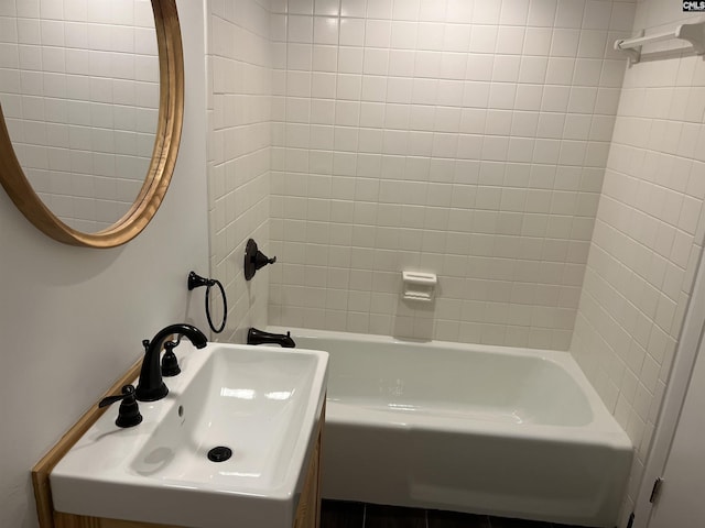 bathroom with shower / bath combination and a sink