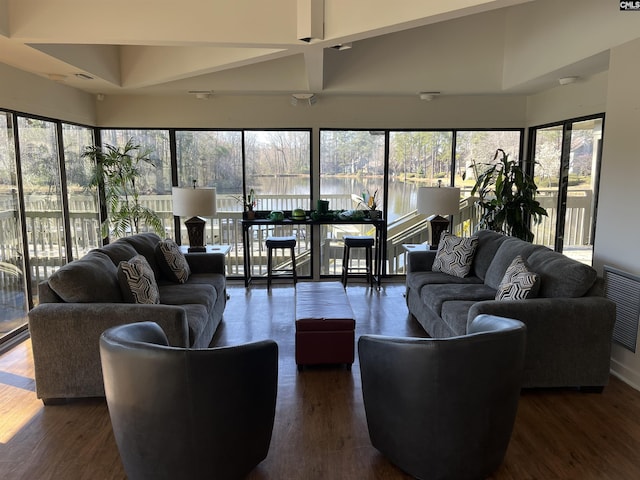 living area featuring dark wood finished floors and visible vents