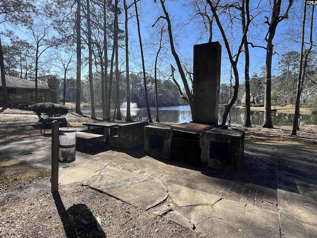 view of patio with a water view