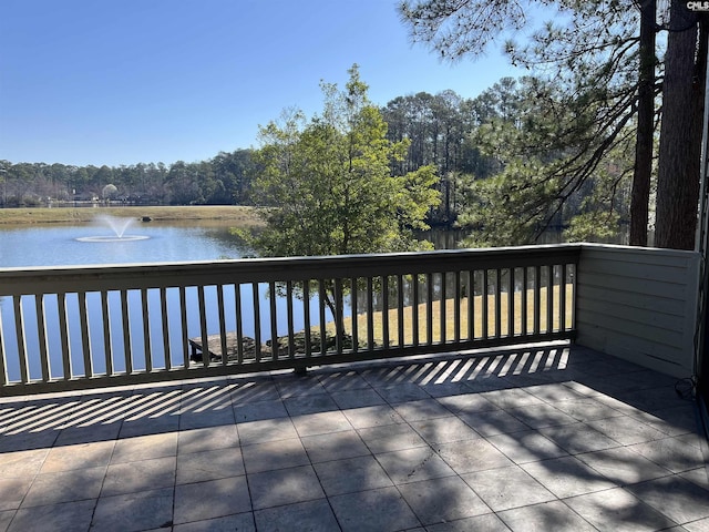 wooden deck with a water view