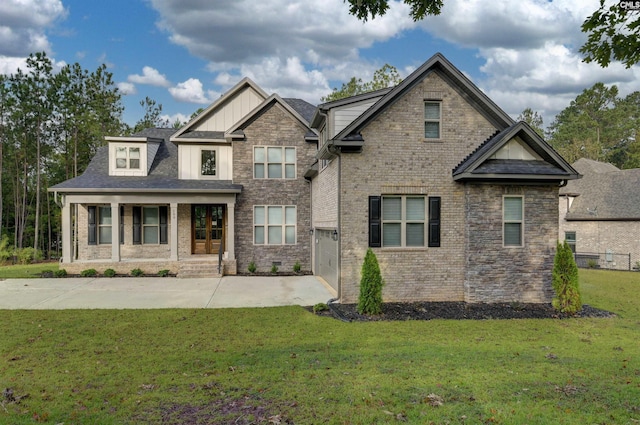 craftsman inspired home featuring brick siding, a porch, concrete driveway, a front yard, and a garage