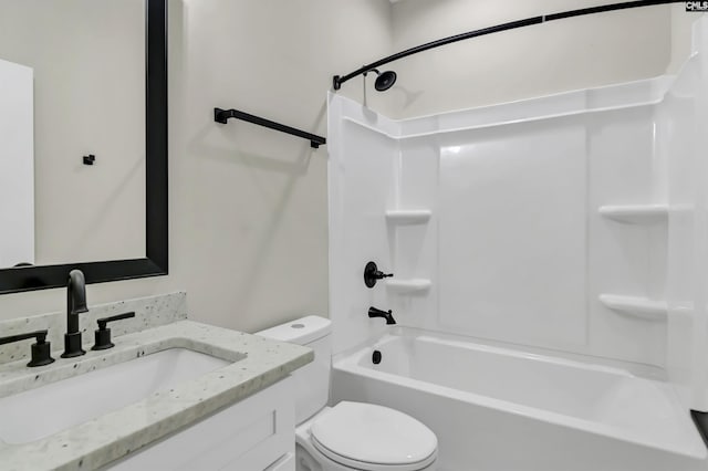 bathroom with vanity, toilet, and shower / bathtub combination