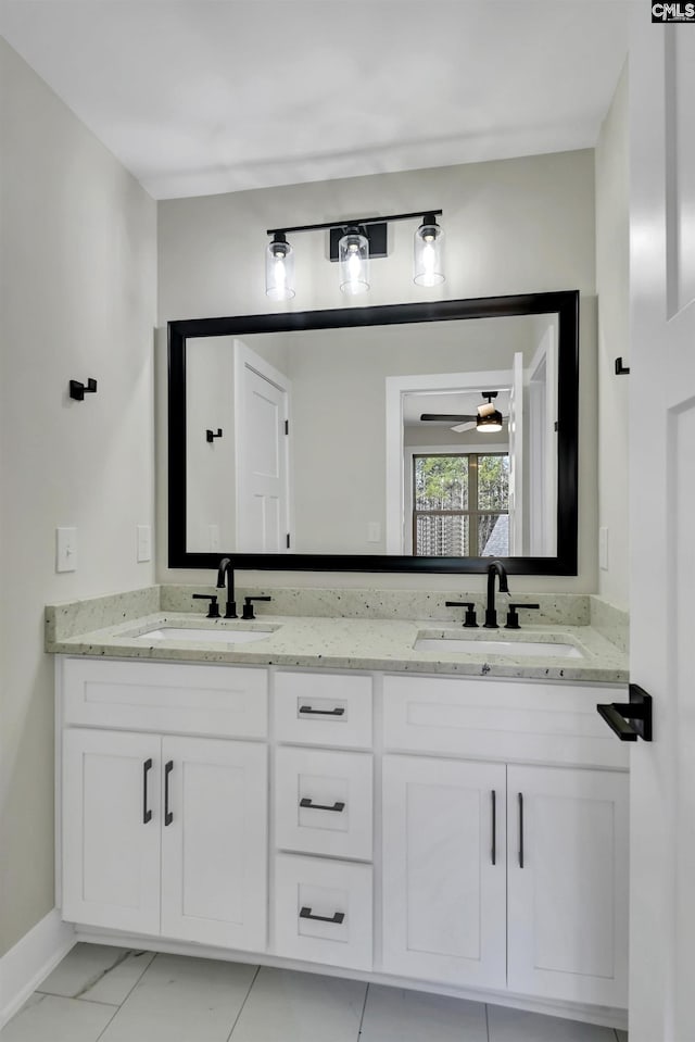 full bathroom featuring double vanity and a sink