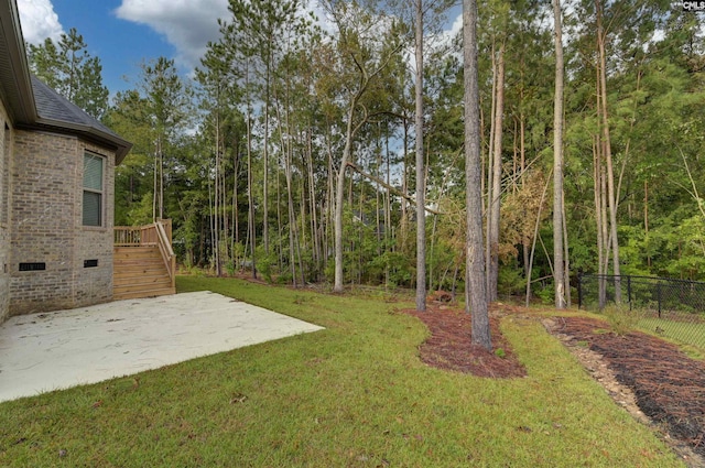 view of yard with a patio area, stairway, and fence