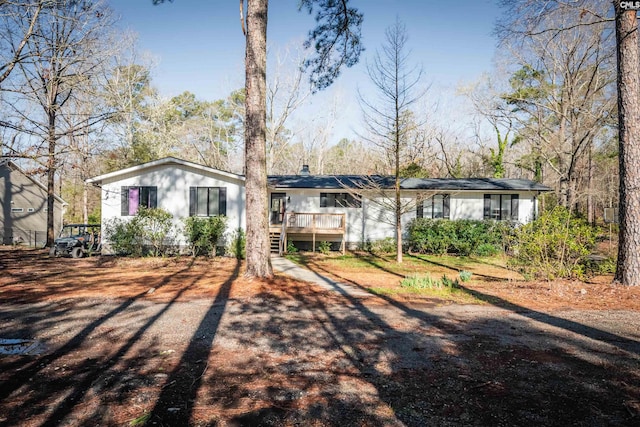 view of front of house with a wooden deck