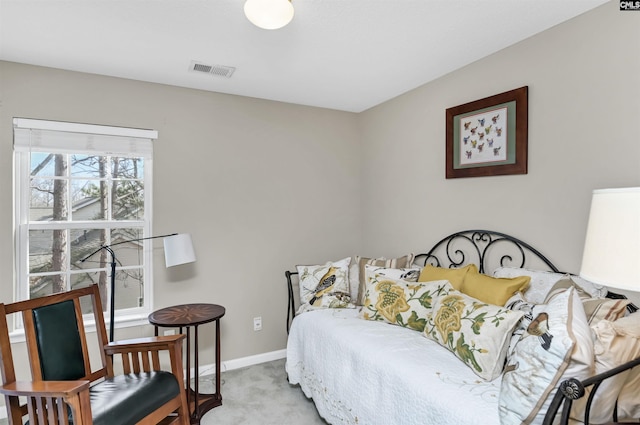 bedroom featuring visible vents, baseboards, and carpet flooring