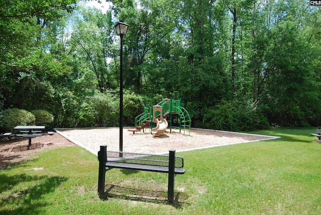 community play area with a lawn