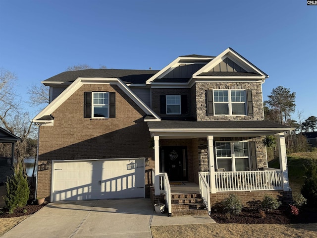 craftsman house with brick siding, board and batten siding, covered porch, driveway, and an attached garage