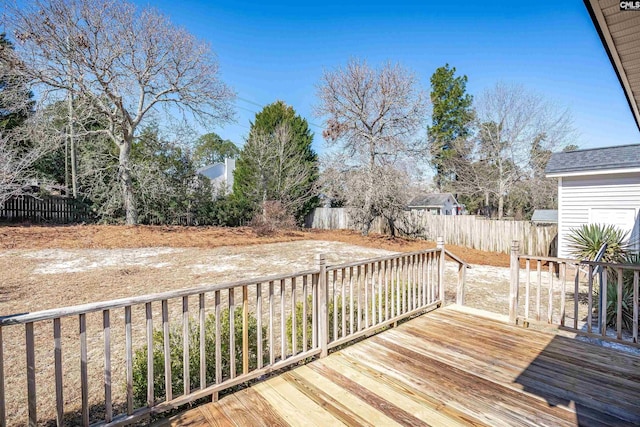 wooden terrace featuring fence