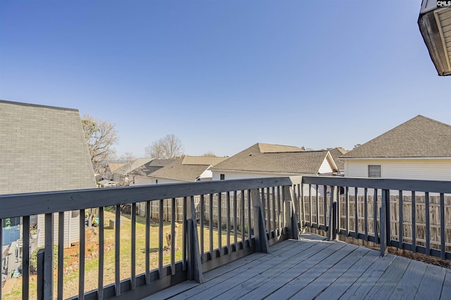 wooden deck featuring a residential view