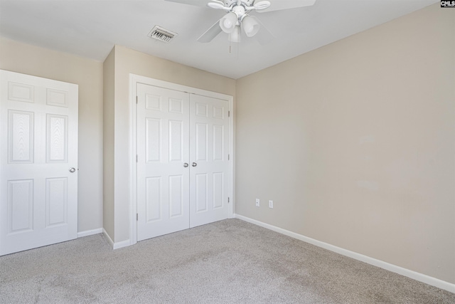 unfurnished bedroom featuring visible vents, a ceiling fan, a closet, carpet flooring, and baseboards