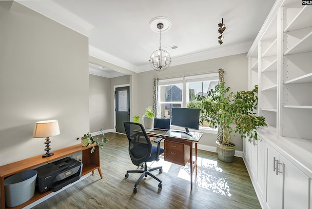 office space featuring visible vents, baseboards, ornamental molding, wood finished floors, and a notable chandelier