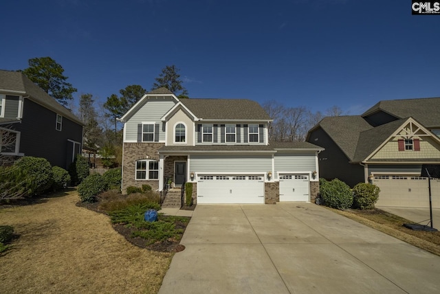 view of front of home featuring stone siding, an attached garage, and driveway