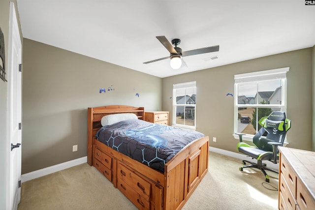 bedroom with light carpet, visible vents, ceiling fan, and baseboards