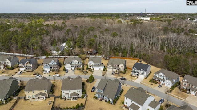 aerial view with a residential view and a wooded view