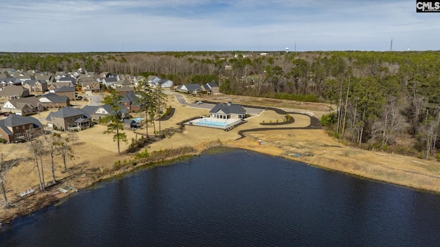 birds eye view of property with a residential view and a water view