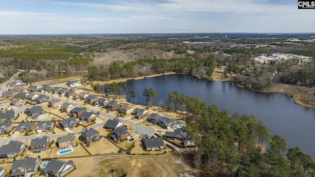 bird's eye view with a residential view, a water view, and a view of trees