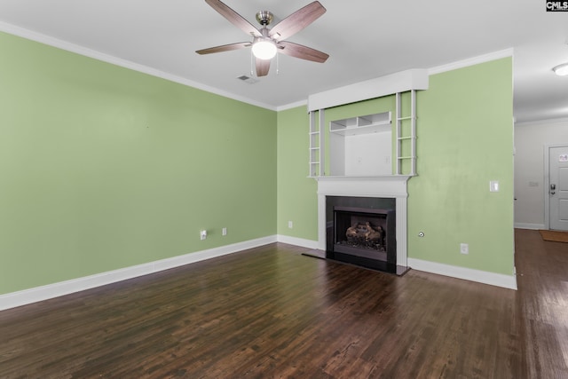 unfurnished living room featuring visible vents, a fireplace with raised hearth, ornamental molding, wood finished floors, and baseboards