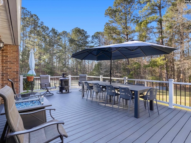 deck with outdoor dining area