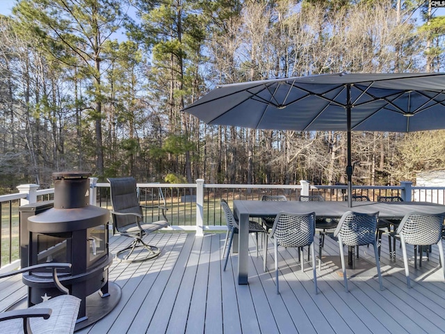 wooden deck with outdoor dining space