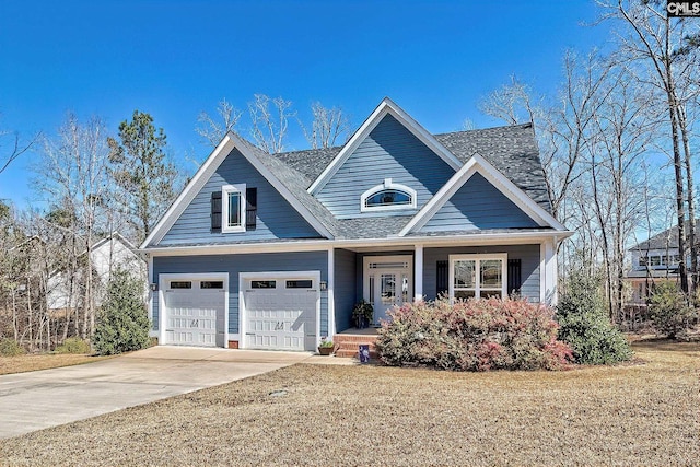 view of front of home with covered porch, concrete driveway, and an attached garage