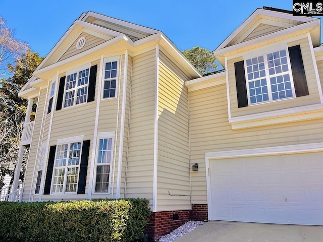 view of home's exterior with crawl space and an attached garage