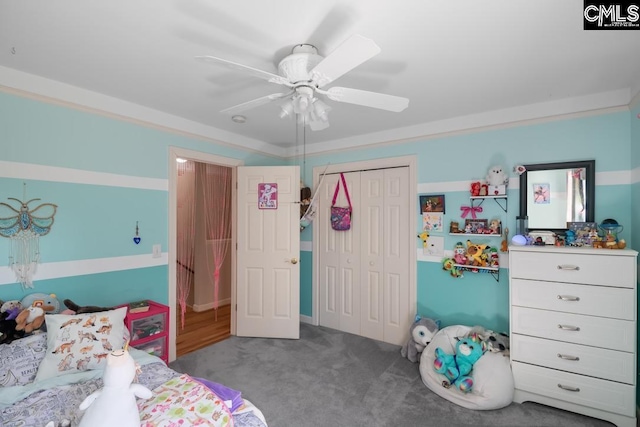 bedroom featuring a closet, carpet floors, and ceiling fan