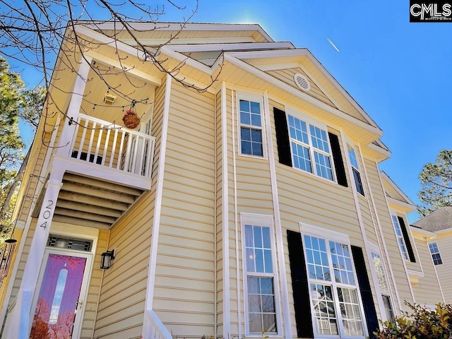 view of property exterior featuring a balcony