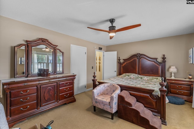 bedroom featuring light carpet and ceiling fan