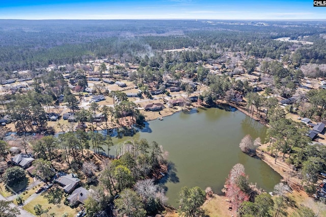 aerial view with a view of trees and a water view