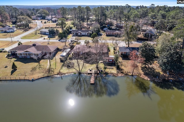 birds eye view of property with a residential view and a water view