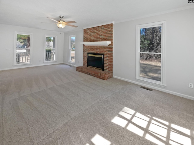 unfurnished living room featuring a fireplace, carpet, visible vents, and baseboards