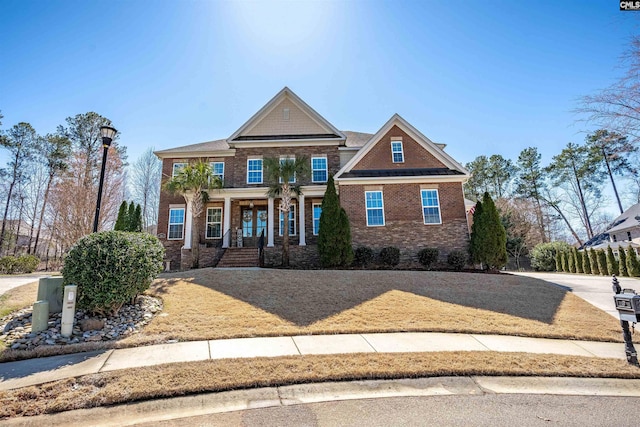 craftsman inspired home with brick siding