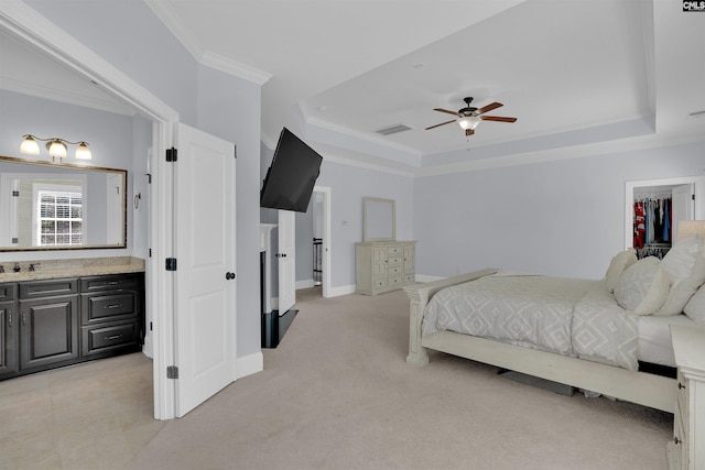 bedroom with light carpet, visible vents, a raised ceiling, and ornamental molding