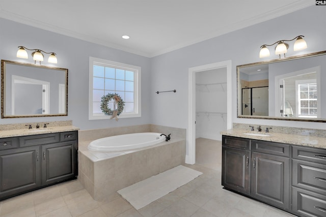 bathroom featuring a sink, plenty of natural light, and a stall shower