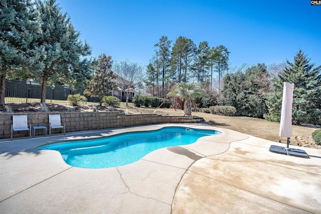 view of pool featuring a patio area, fence, and a fenced in pool