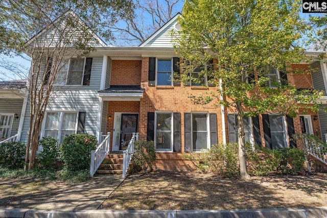 view of front of property featuring brick siding