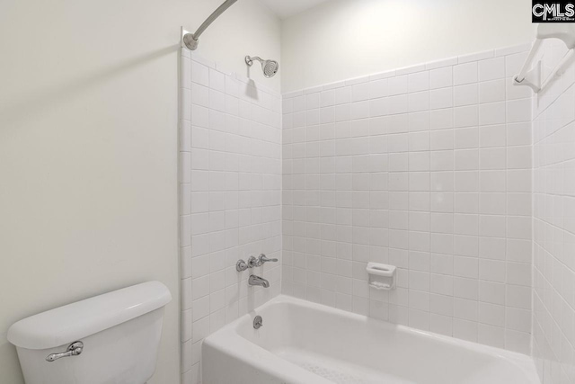 bathroom featuring bathing tub / shower combination and toilet