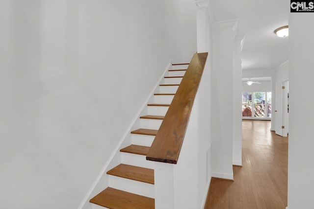 stairs featuring baseboards and wood finished floors