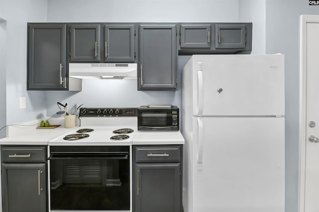 kitchen featuring gray cabinetry, electric stove, under cabinet range hood, freestanding refrigerator, and light countertops