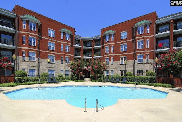 view of pool with fence