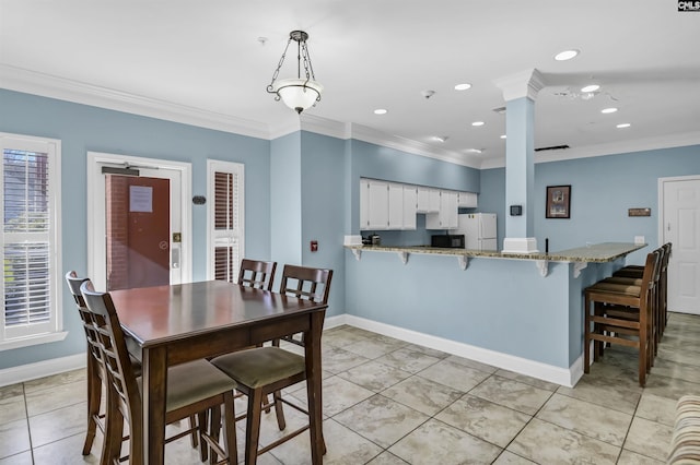 dining room with baseboards, decorative columns, ornamental molding, recessed lighting, and light tile patterned flooring