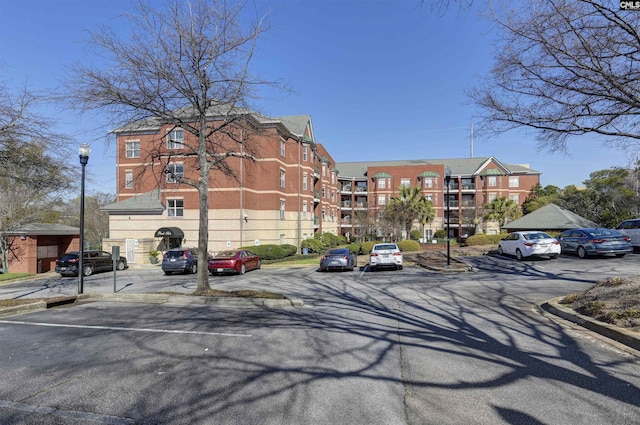 view of property featuring uncovered parking