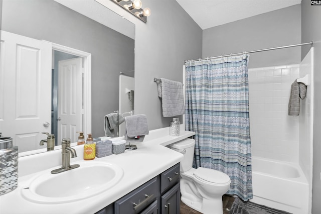 bathroom featuring toilet, shower / bath combo, and vanity