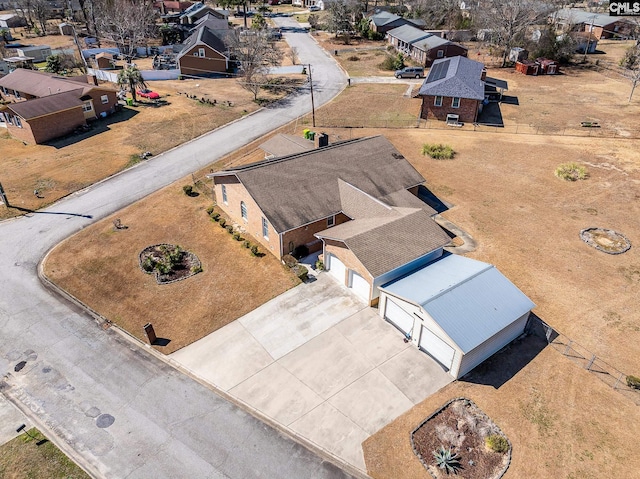 birds eye view of property with a residential view