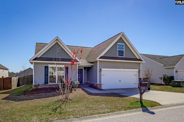 view of front of property featuring a front lawn, board and batten siding, driveway, and fence